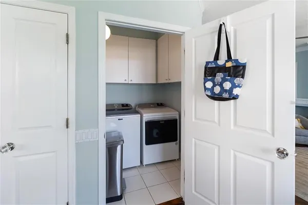 a kitchen with a refrigerator and a stove