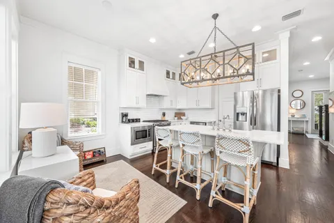 a view of a dining room with furniture and wooden floor