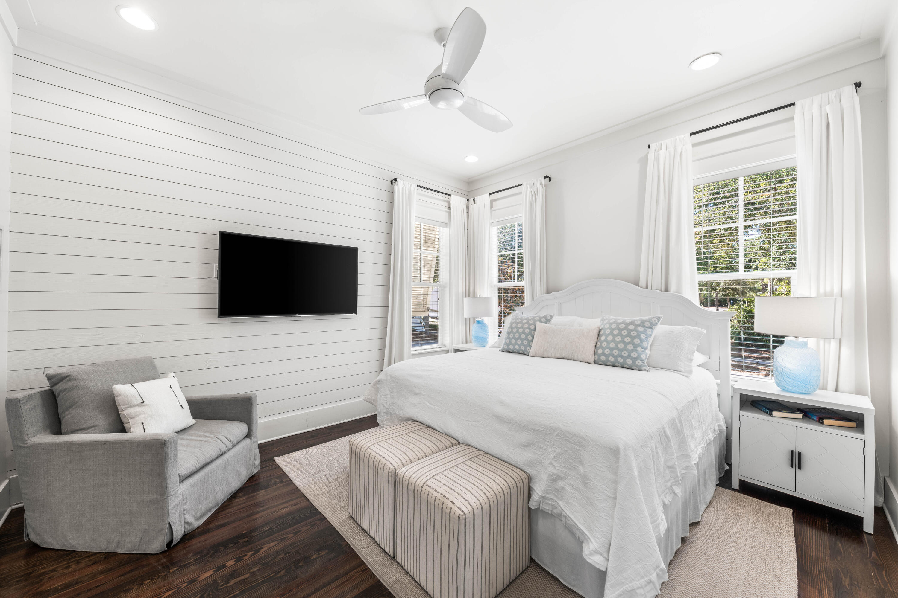 8 Hiker Street Santa Rosa Beach, FL 32459 - Photo 16 of 41 a bedroom with a large bed a flat tv screen and a couch