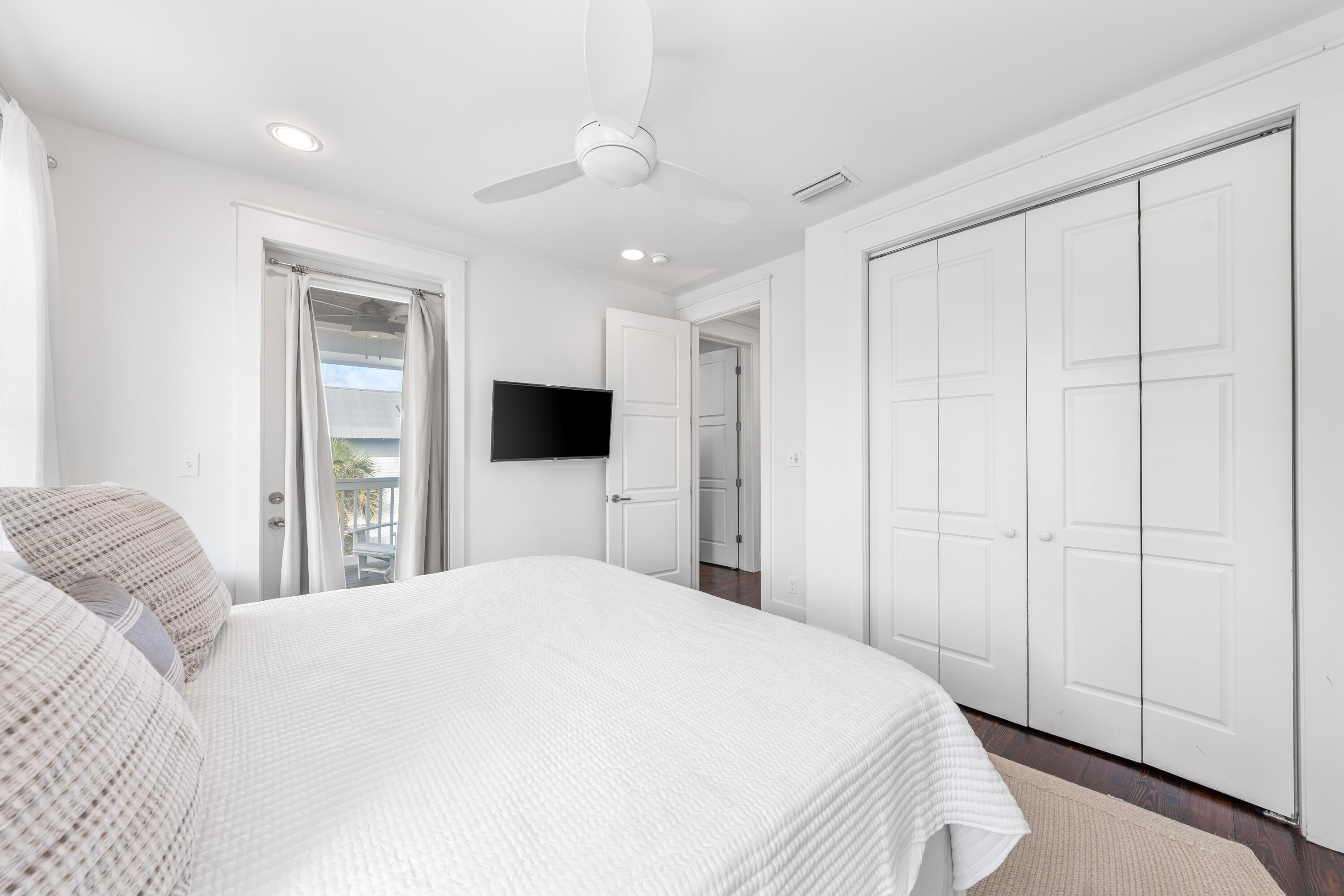 8 Hiker Street Santa Rosa Beach, FL 32459 - Photo 27 of 41 a bedroom with a large bed and a flat tv screen