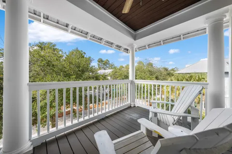 a view of balcony with furniture