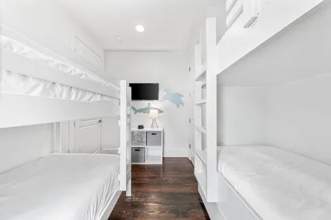 a bathroom with a bathtub and a hallway