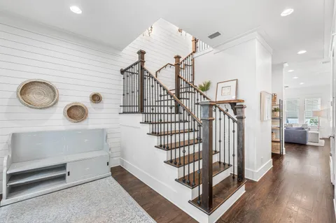 a view of entryway with a window and wooden floor