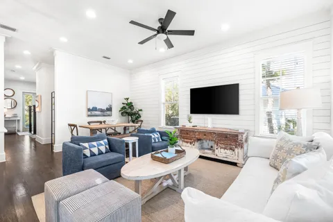 a living room with furniture fireplace and a flat screen tv