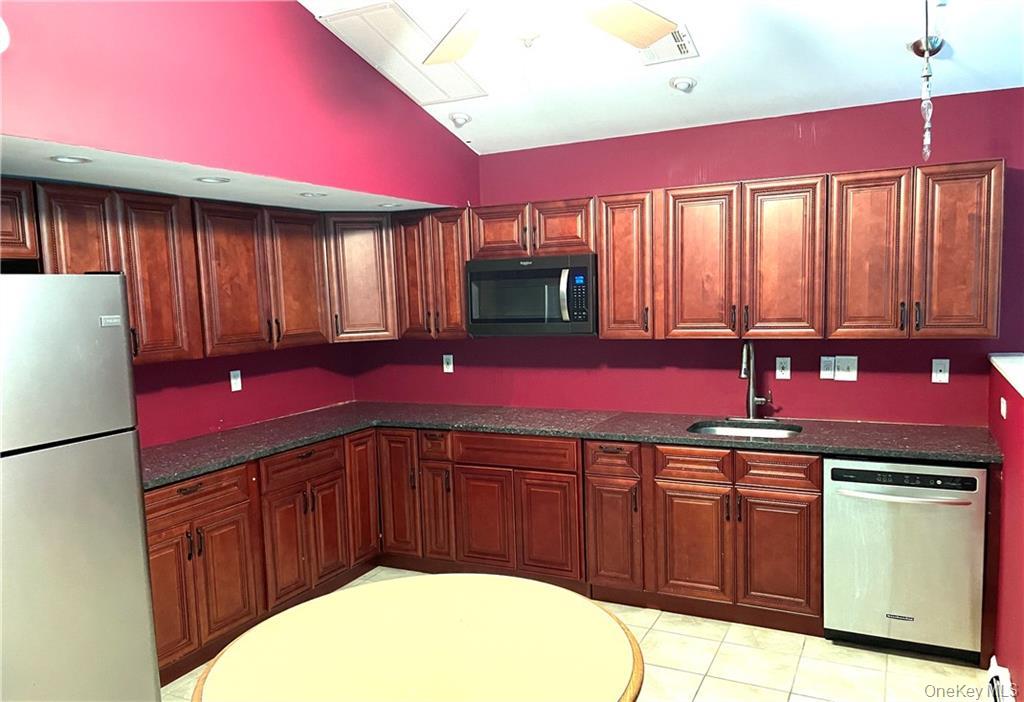 80 Old Quaker Hill Road, Unit 2 Monroe, NY 10950 - Photo 11 of 20 a kitchen with a sink cabinets and wooden floor