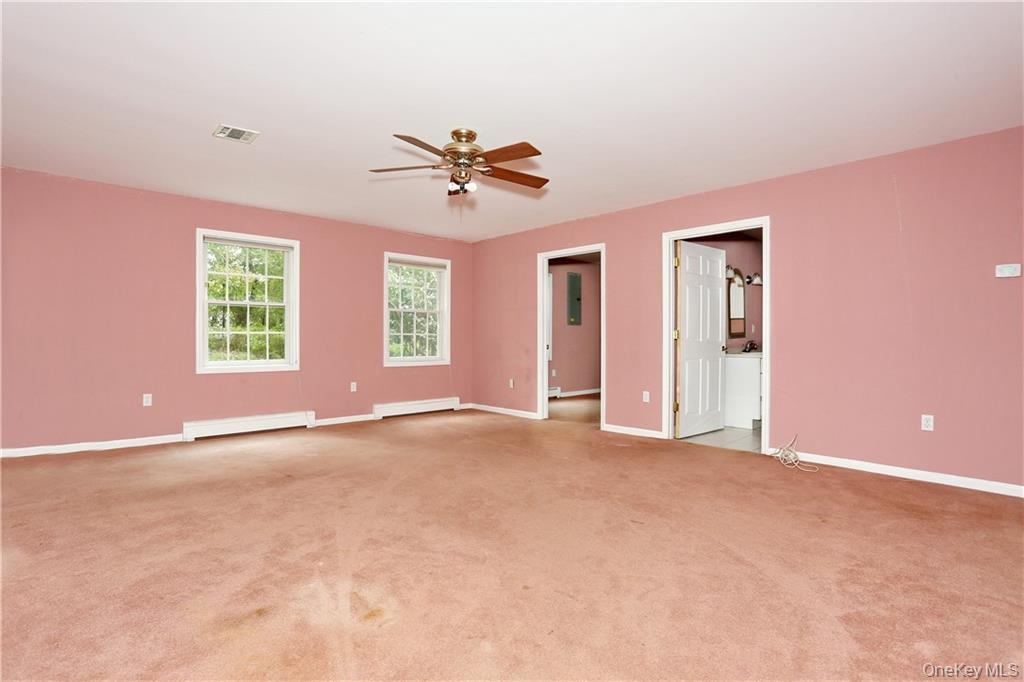 80 Old Quaker Hill Road, Unit 2 Monroe, NY 10950 - Photo 12 of 20 a view of an empty room with a window