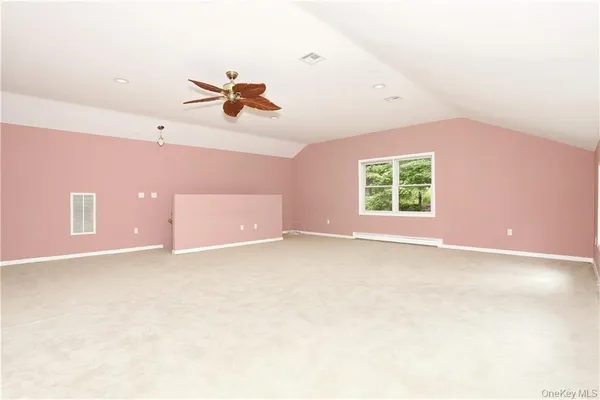 a view of grassy field with trees