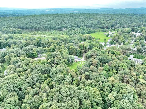 a aerial view of a house with a yard