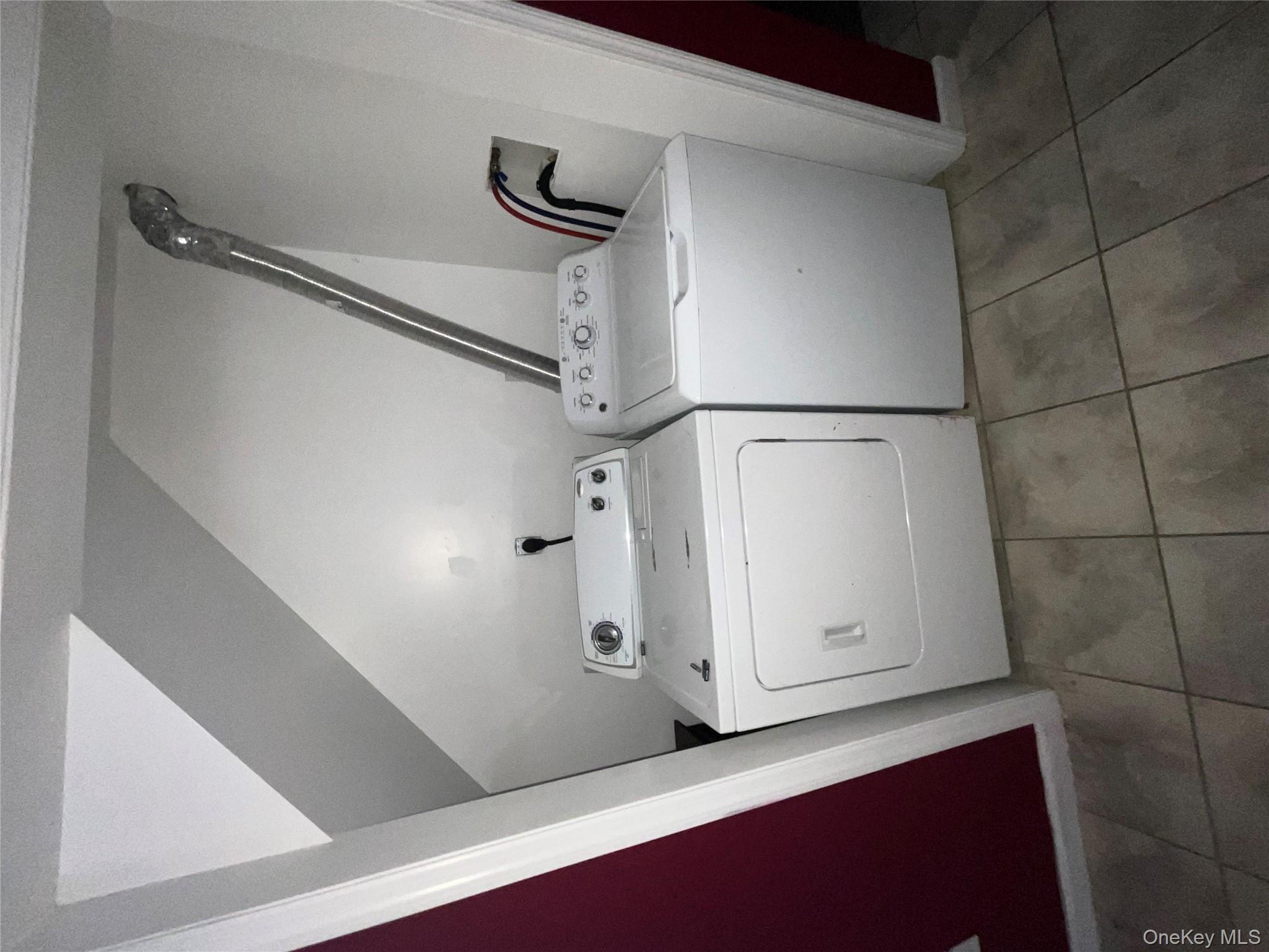 80 Old Quaker Hill Road, Unit 2 Monroe, NY 10950 - Photo 2 of 20 a utility room with dryer and washer