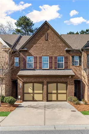 a front view of a house with a garage