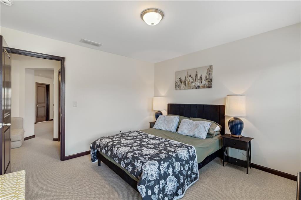 4430 Cedar Bridge Walk Suwanee, GA 30024 - Photo 25 of 33 a bedroom with a bed and a window