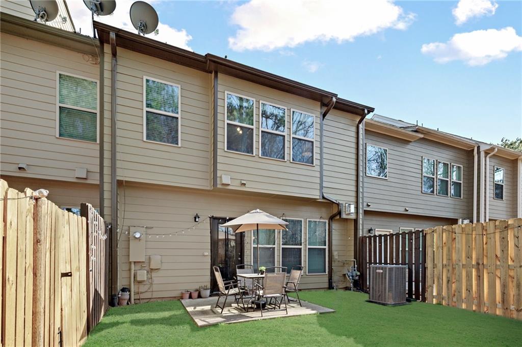 4430 Cedar Bridge Walk Suwanee, GA 30024 - Photo 30 of 33 a front view of a house with garden