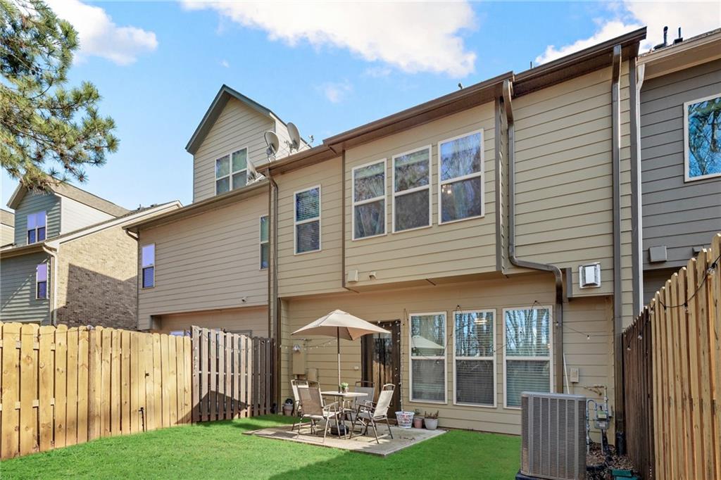 4430 Cedar Bridge Walk Suwanee, GA 30024 - Photo 31 of 33 a front view of a house with a yard and porch