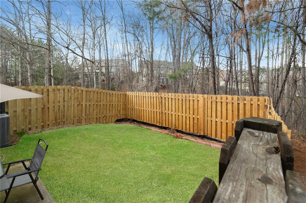 4430 Cedar Bridge Walk Suwanee, GA 30024 - Photo 33 of 33 a view of backyard with garden and deck