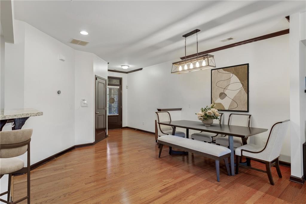 4430 Cedar Bridge Walk Suwanee, GA 30024 - Photo 5 of 33 a view of a room with furniture and wooden floor