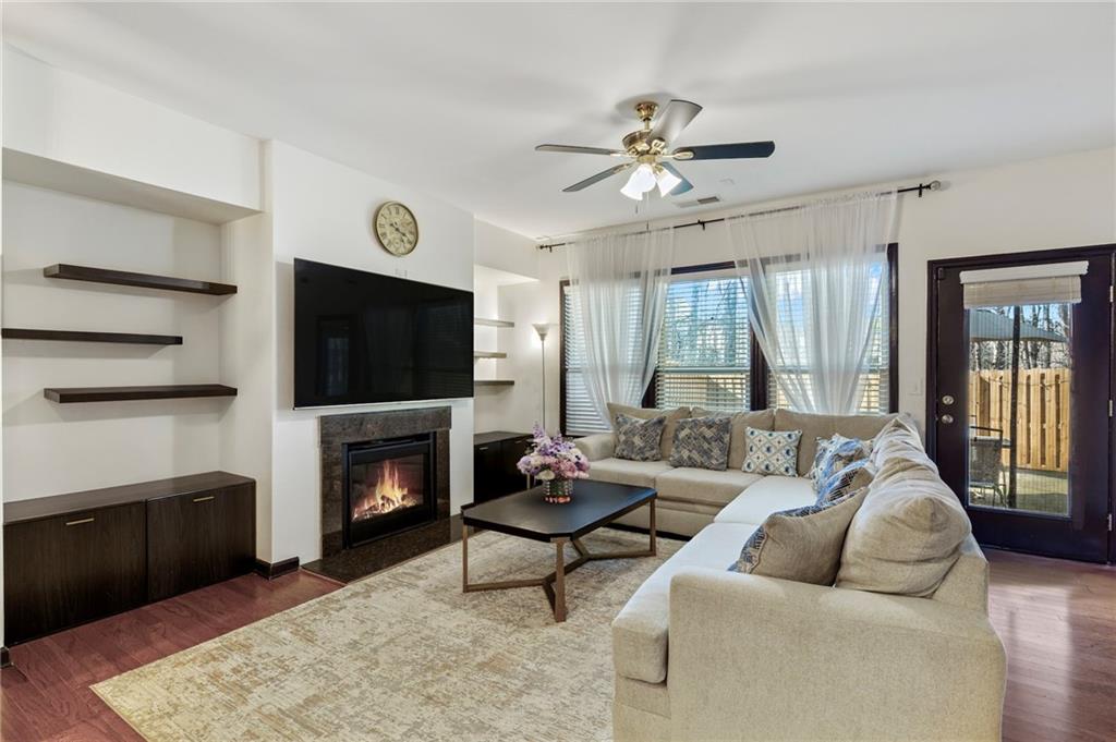4430 Cedar Bridge Walk Suwanee, GA 30024 - Photo 6 of 33 a living room with furniture fireplace and flat screen tv