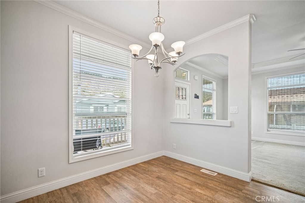 250 East Telegraph Road, Unit 307 Fillmore, CA 93015 - Photo 8 of 36 a view of an room with chandelier fan and windows