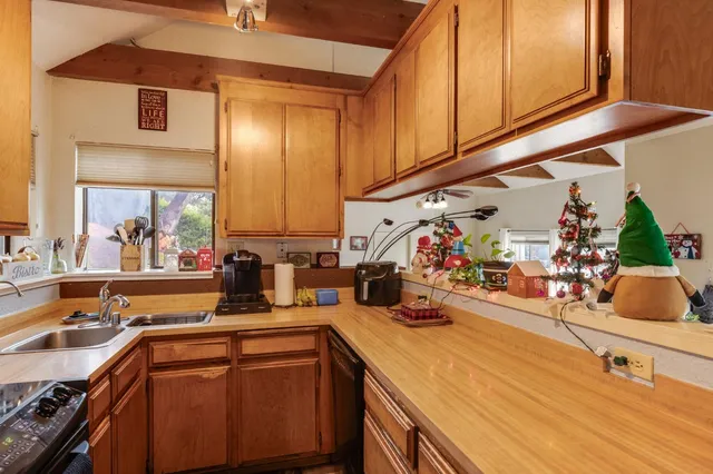 a kitchen with a sink and cabinets