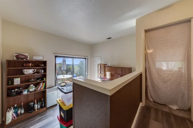 a bedroom with bed and a chandelier