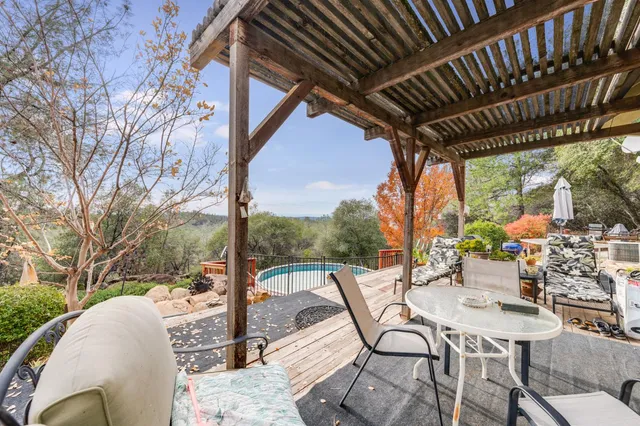a view of porch with furniture and garden