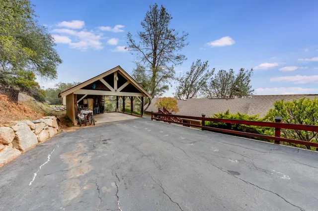 a view of a patio with wooden fence