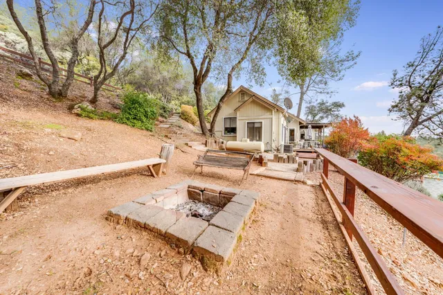 a view of a house with a yard covered with snow