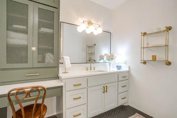 a bathroom with a sink and a mirror