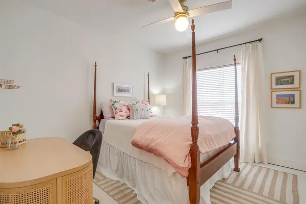 a bed room with a bed and a chandelier