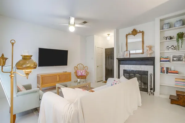 a bedroom with a bed and a television