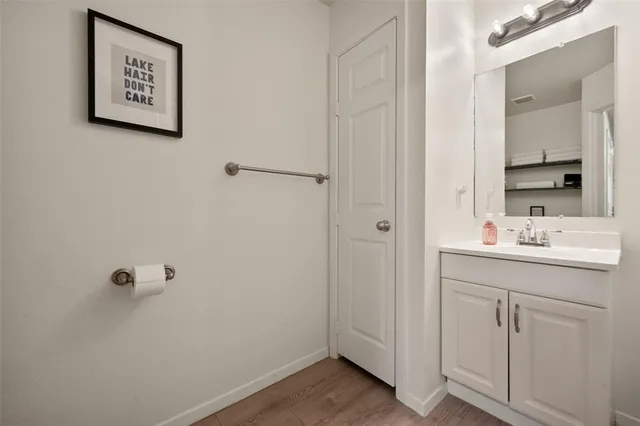 a bathroom with a sink and mirror