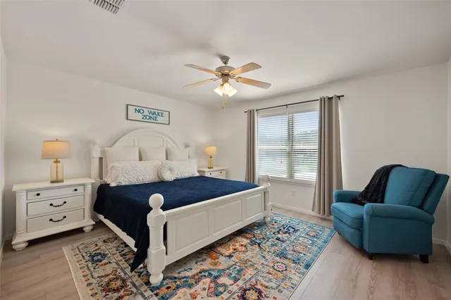 a spacious bedroom with a bed and a couch