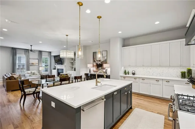 a kitchen with stainless steel appliances granite countertop a stove and a refrigerator