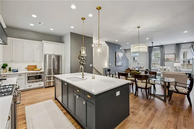 a bathroom with a granite countertop sink toilet a mirror and shower