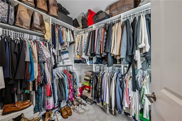 a bathroom with double vanity sinks and a mirror