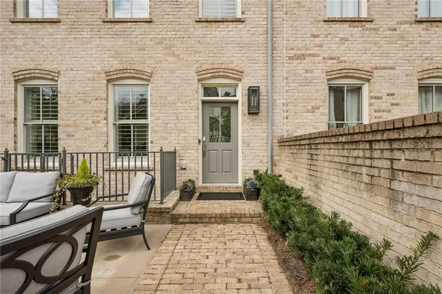 a living room with furniture fireplace and flat screen tv