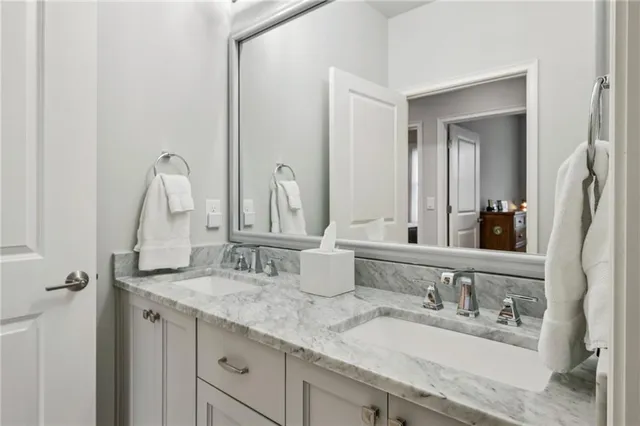 a living room with furniture a flat screen tv and a window