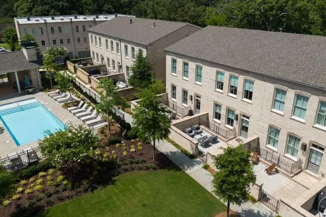 a view of a park with large trees