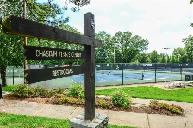 a view of a table and chairs under an umbrella