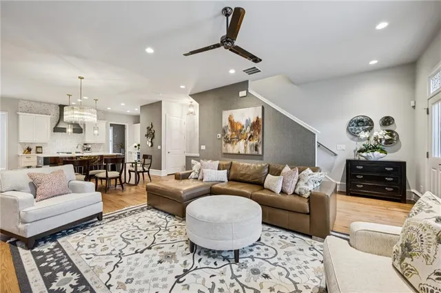 a large kitchen with a table and chairs