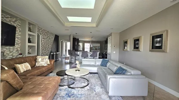 a dining room with furniture window and wooden floor