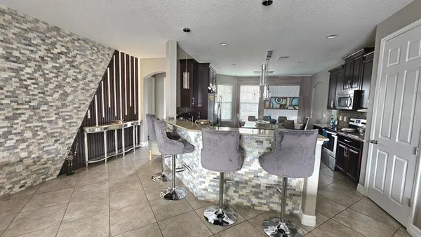 a lobby with furniture and a fireplace