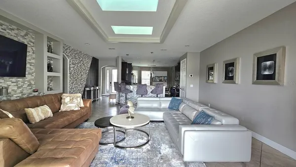 a view of a dining room with furniture and window