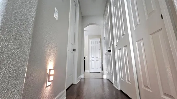 a bedroom with a bed table and a window