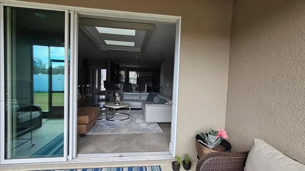 a room with furniture and a large window