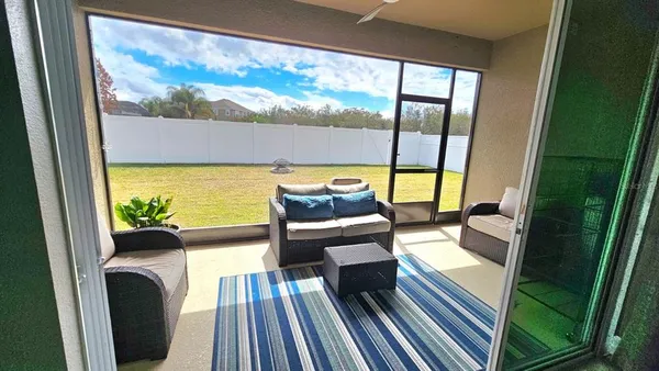a view of a balcony with chair and table