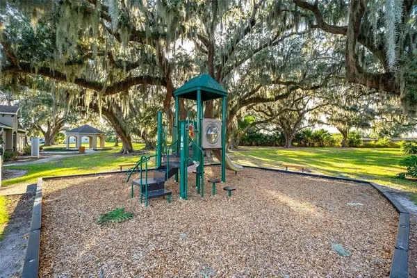 a living room with furniture and a dining table
