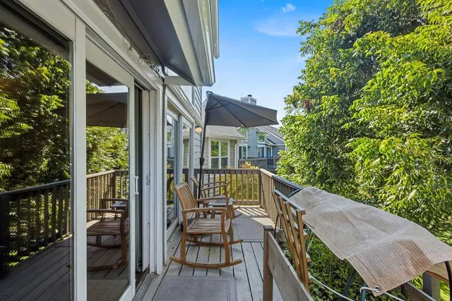 a view of balcony with furniture