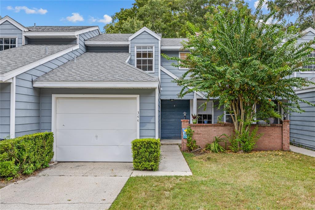 344 Northwest 48th Boulevard, Unit K Gainesville, FL 32607 - Photo 1 of 1 front view of a house with a yard