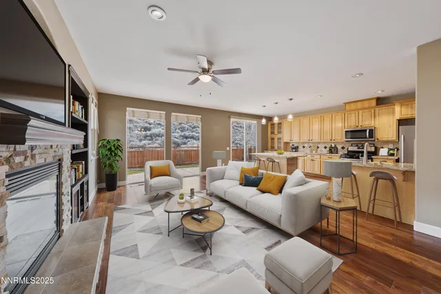 a living room with furniture fireplace and a flat screen tv