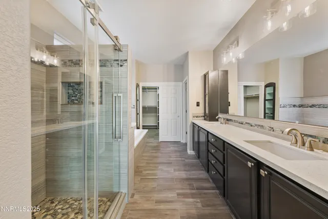 a bathroom with a double vanity sink and a mirror